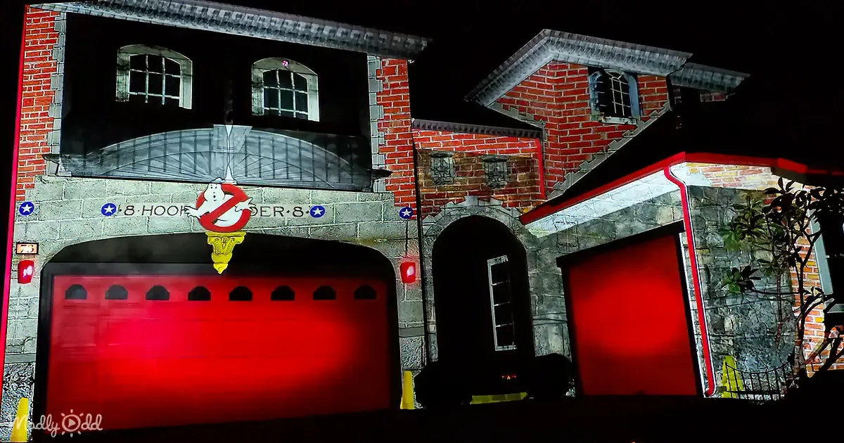 A Ghostbusters-themed fire station with red doors and the iconic Ghostbusters logo above.