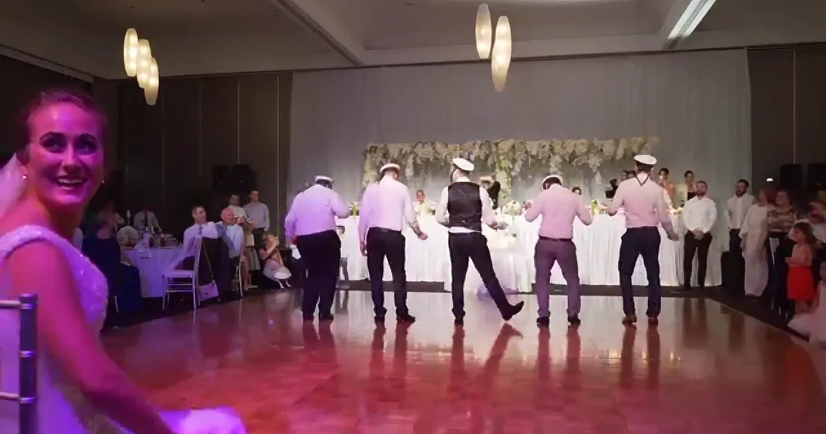 Groom and Friends Don Caps for Hilarious Unexpected Dance
