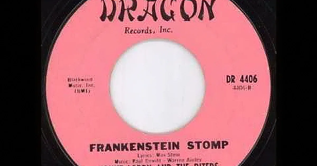 A vintage vinyl record with "Frankenstein Stomp" by Count Lorry and The Biters on a pink label.