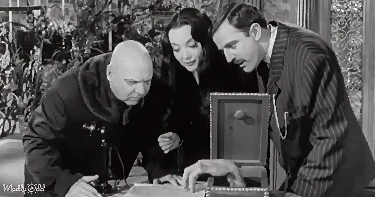 Three individuals examine a map and a small object on a table, with a vintage setting.