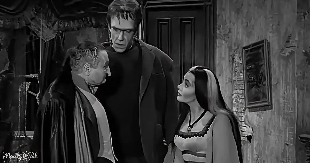 A man in a suit stands between a woman in a dress and another man in a robe, in a dimly lit room.