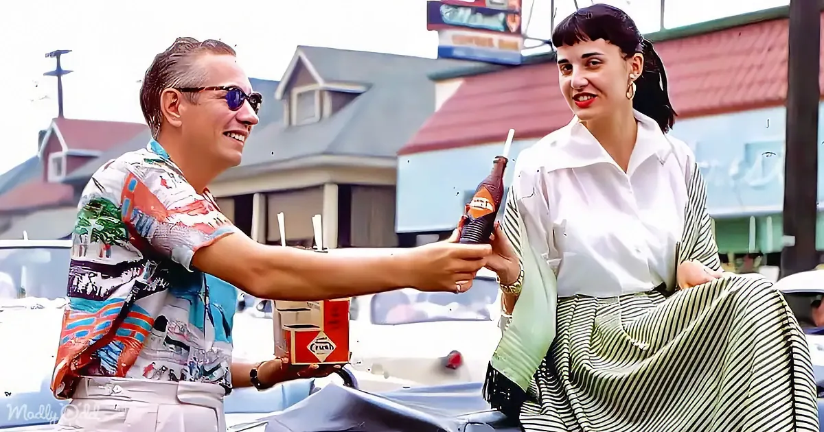 Three women in 1950s attire pose beside a vintage car, while a family sits in another car outside Long's Village Pump.
