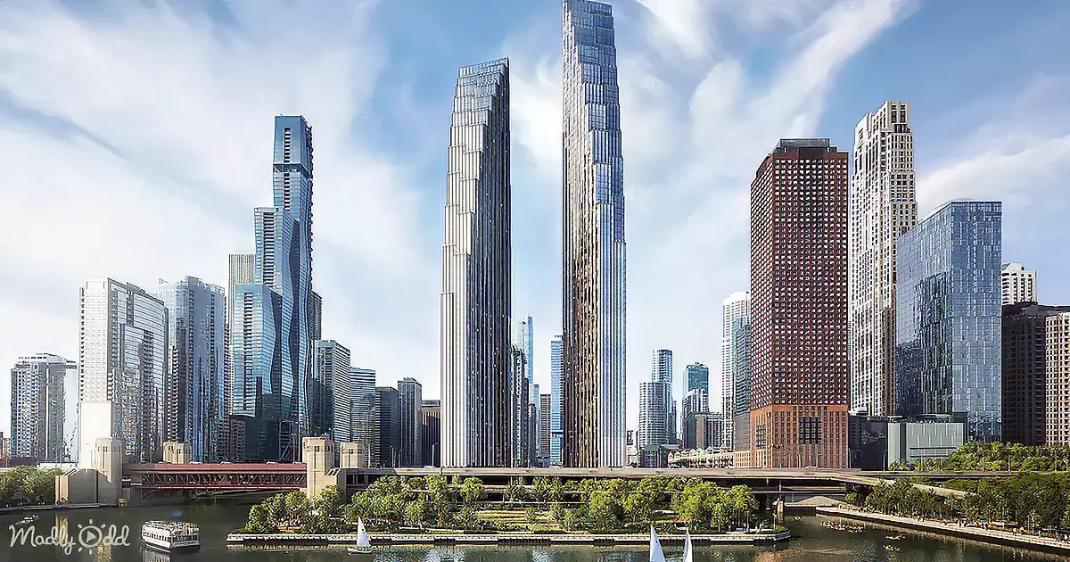Modern skyscrapers and a bridge over a river with boats and greenery in the foreground.