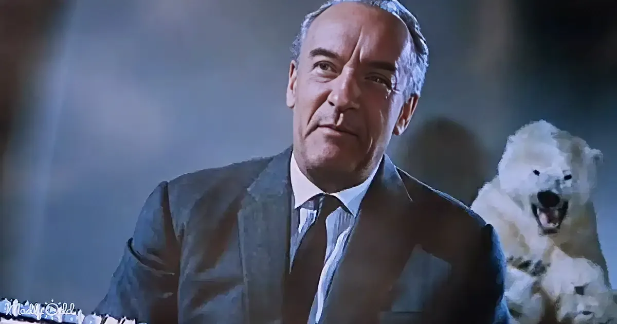 A man in a suit and tie looks concerned, with a polar bear in the background.