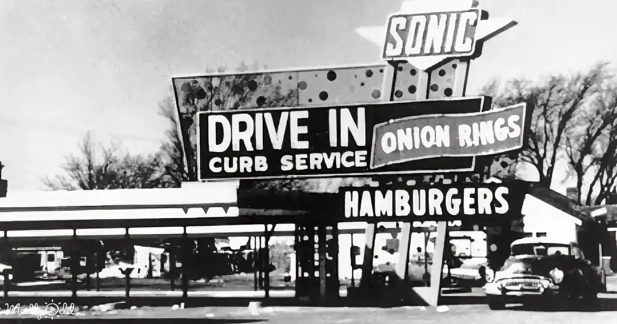 A vintage Sonic Drive-In sign advertises curb service, hamburgers, and onion rings.