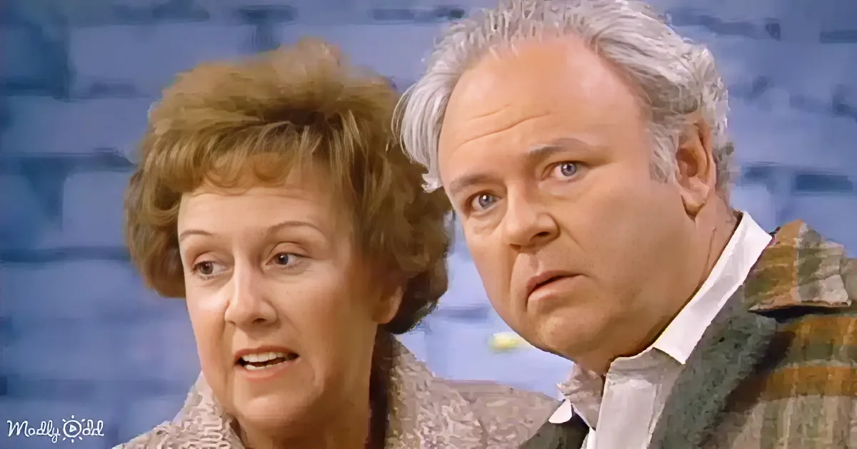 A woman with short brown hair and a man with gray hair and a plaid shirt are looking to the side.