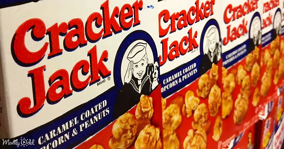 Cracker Jack boxes with caramel-coated popcorn and peanuts, sailor mascot, red and white packaging.