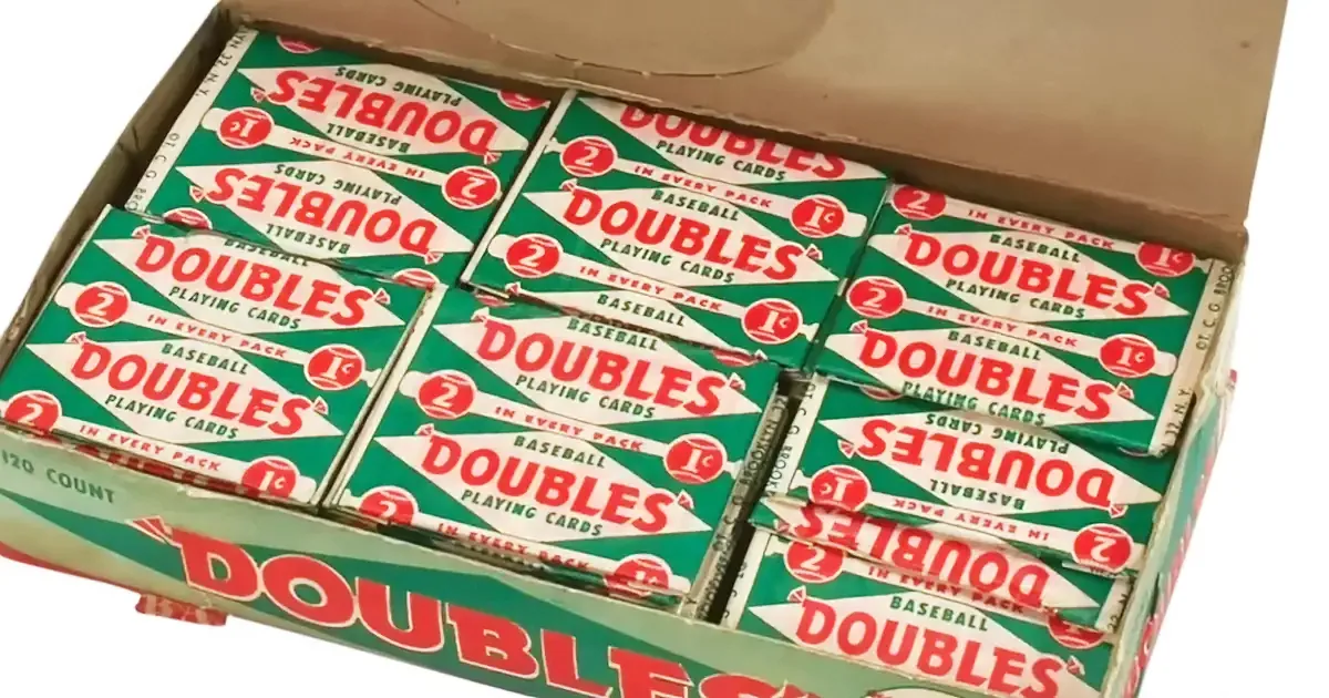 A box of vintage "Doubles" baseball playing cards, each pack containing two cards, neatly arranged.
