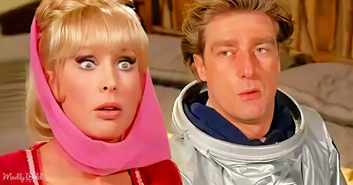 A woman in a red outfit and pink scarf looks surprised, next to a man in a silver spacesuit.