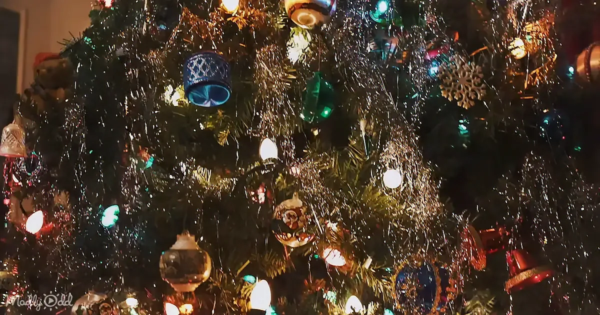 A beautifully decorated Christmas tree adorned with lights, ornaments, and tinsel.
