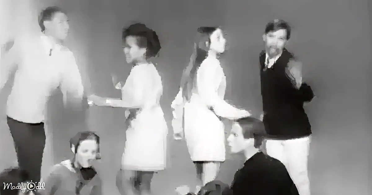 A man in a white shirt and dark pants shakes hands with a woman in a white dress, surrounded by other people.
