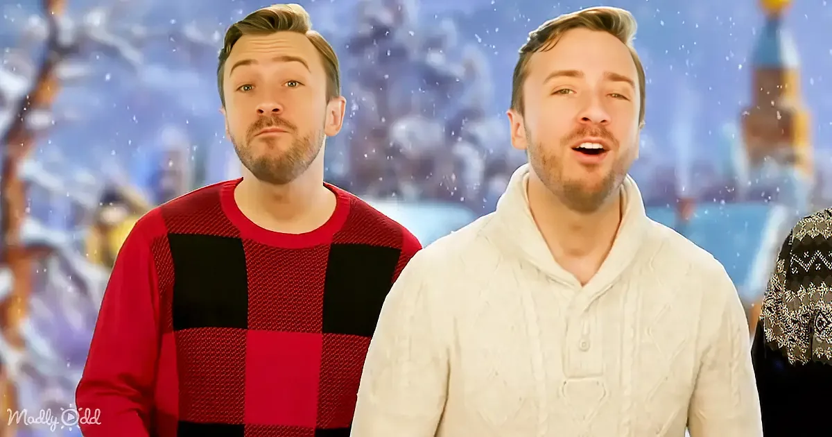 Two men in festive sweaters, one singing, snowy background, Christmas vibe.
