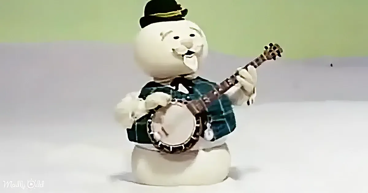 A snowman figurine wearing a hat and plaid shirt plays a banjo.