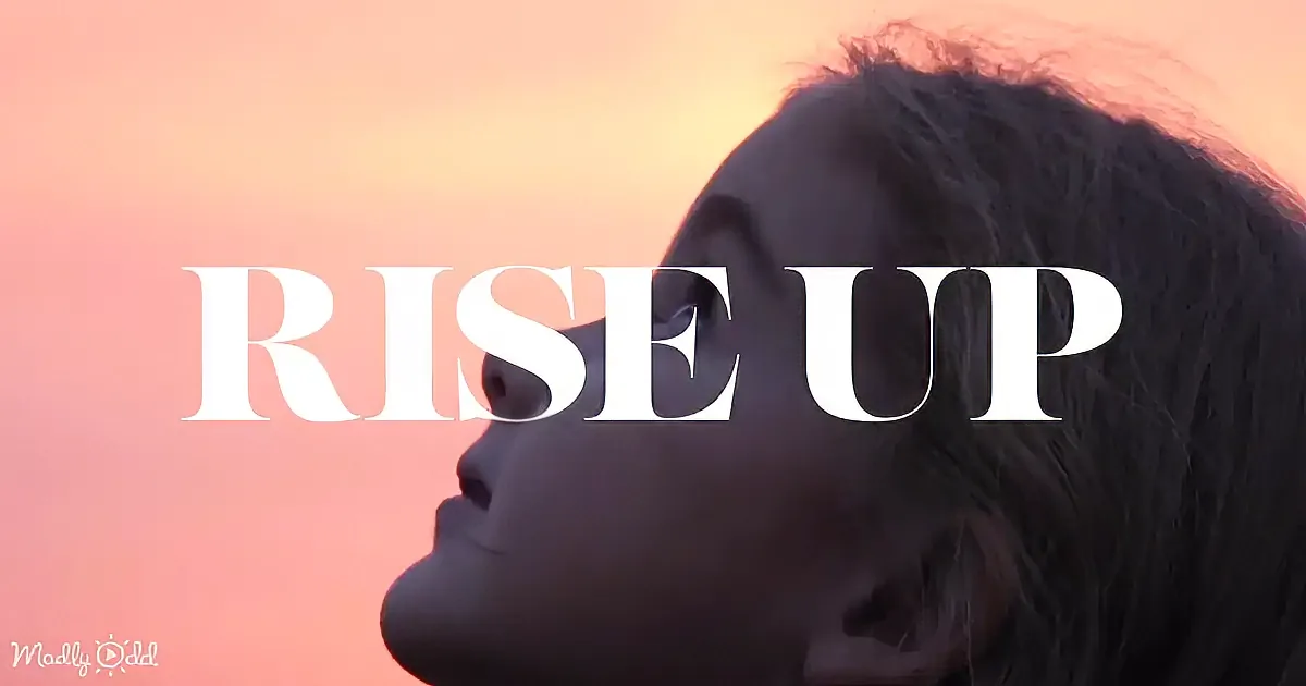 A silhouette of a person with "RISE UP" text overlaid against a gradient sky.