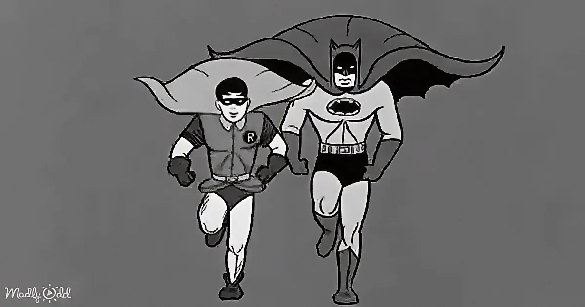 Batman and Robin run side by side, both in classic superhero costumes, with Batman's cape flowing behind him.