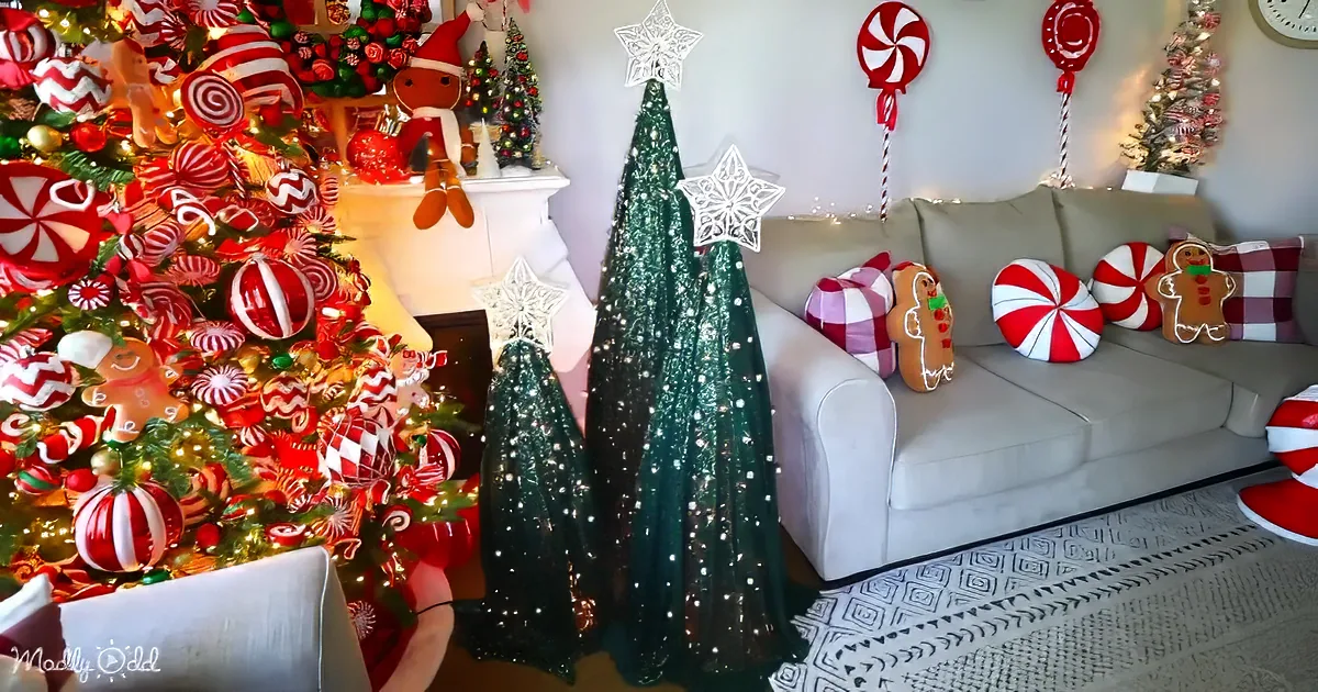 A festive Christmas living room with a candy-themed tree, gingerbread pillows, and sparkling decorations.