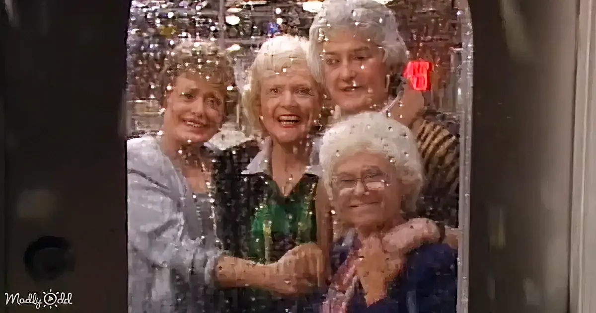 Four smiling women, dressed in festive attire, stand together with a sparkling background, creating a joyful and...