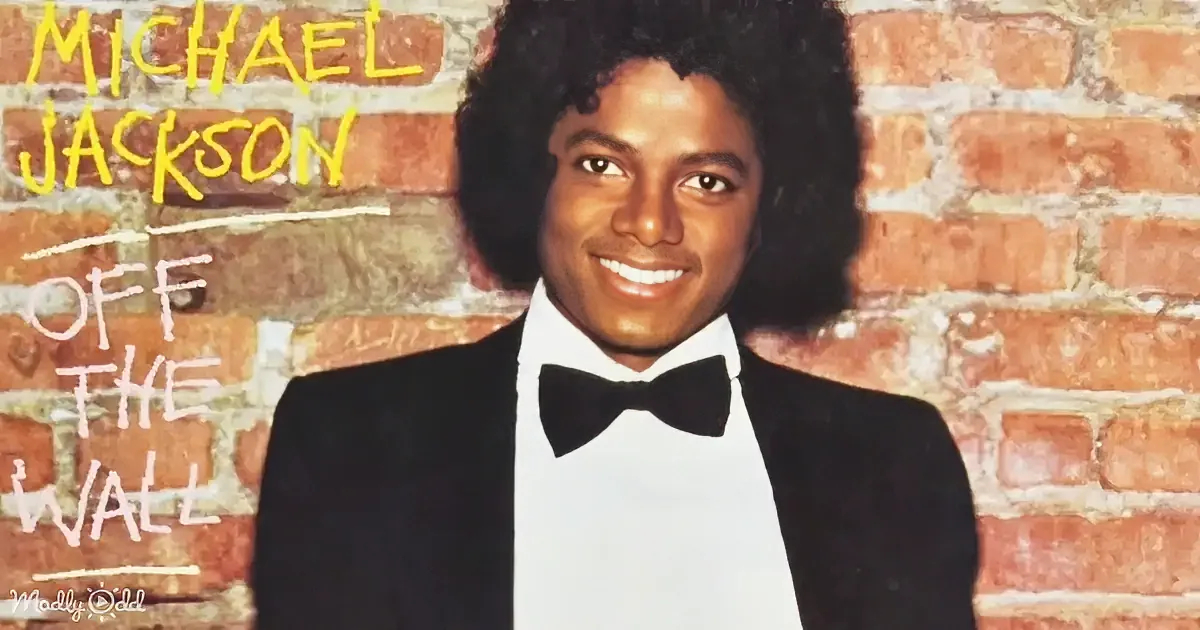 Michael Jackson in a tuxedo smiles against a brick wall with "Off the Wall" text.