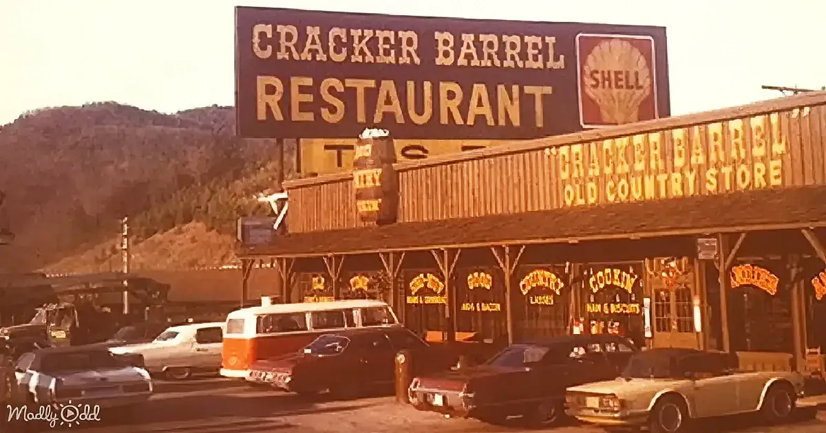 Cracker Barrel Restaurant and Old Country Store with vintage cars and a Shell gas station sign.