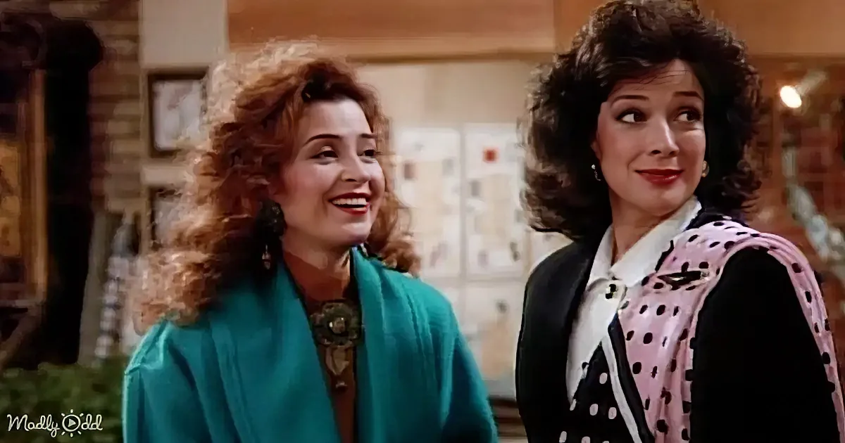 Two women with curly hair, one in teal, the other in polka dots, smiling and looking to the side.