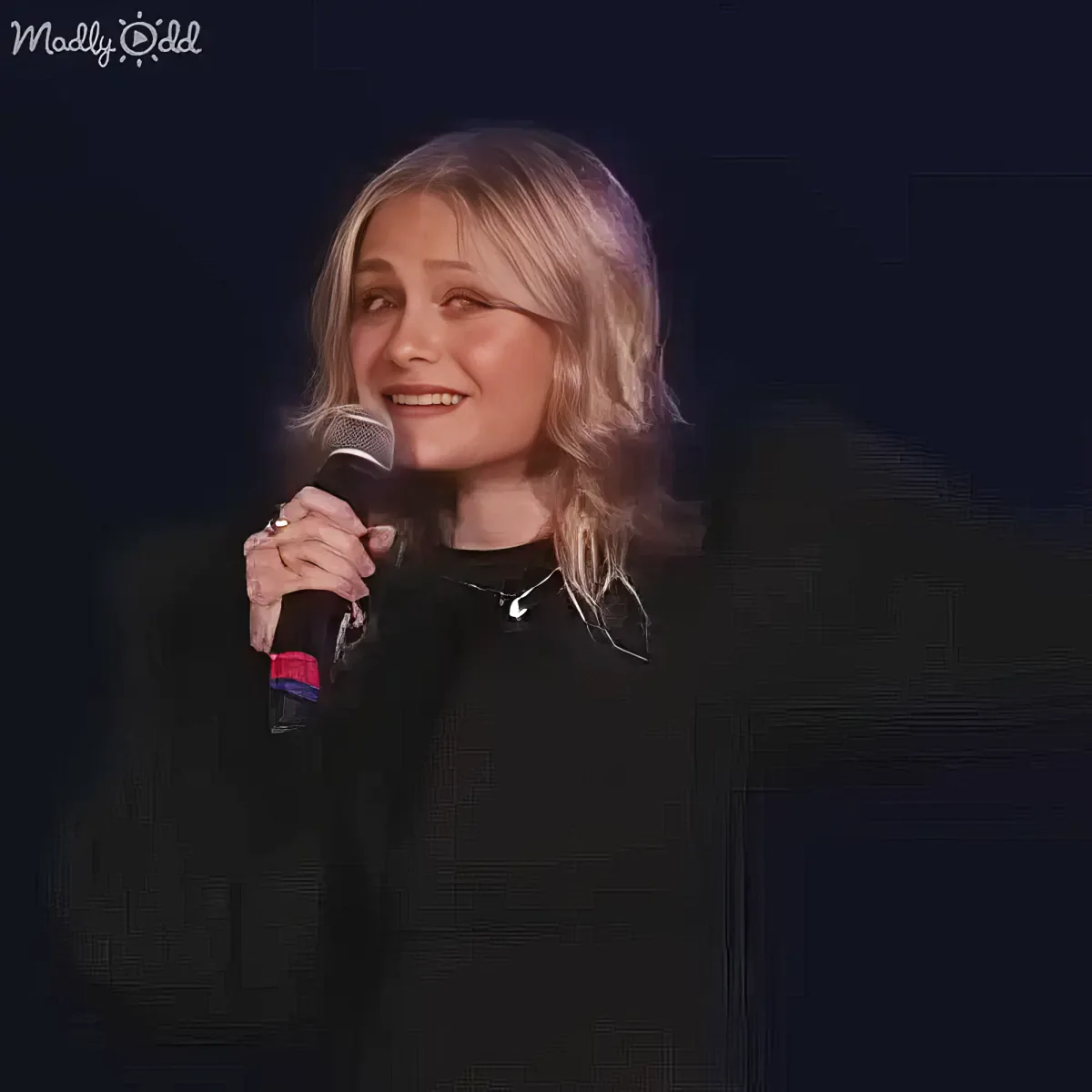 Close up of Darci Lynne and puppet singing