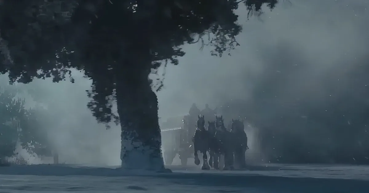 Horses pulling a carriage through a foggy, snowy landscape with trees in the background.