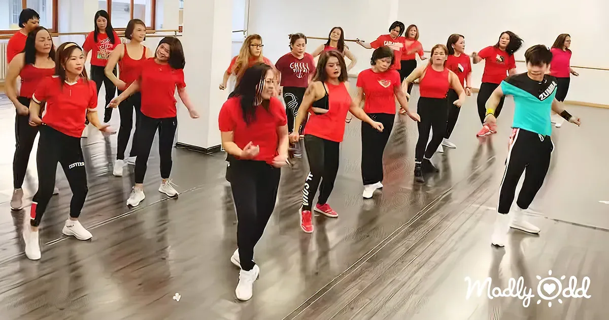 Women's 'Islands in the Stream' Dance Gets Hijacked by Talented Green Man