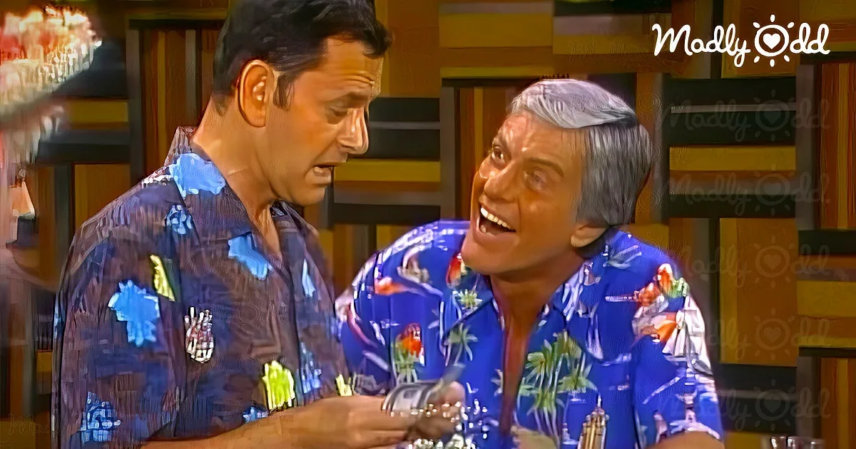 Two men in Hawaiian shirts are engaged in a conversation at a bar.