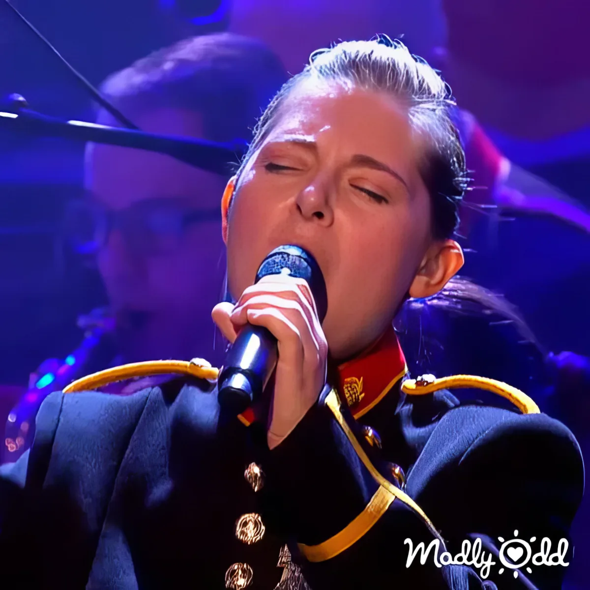 Military band performs 'Stairway to Heaven,' members in uniform, instruments gleaming.