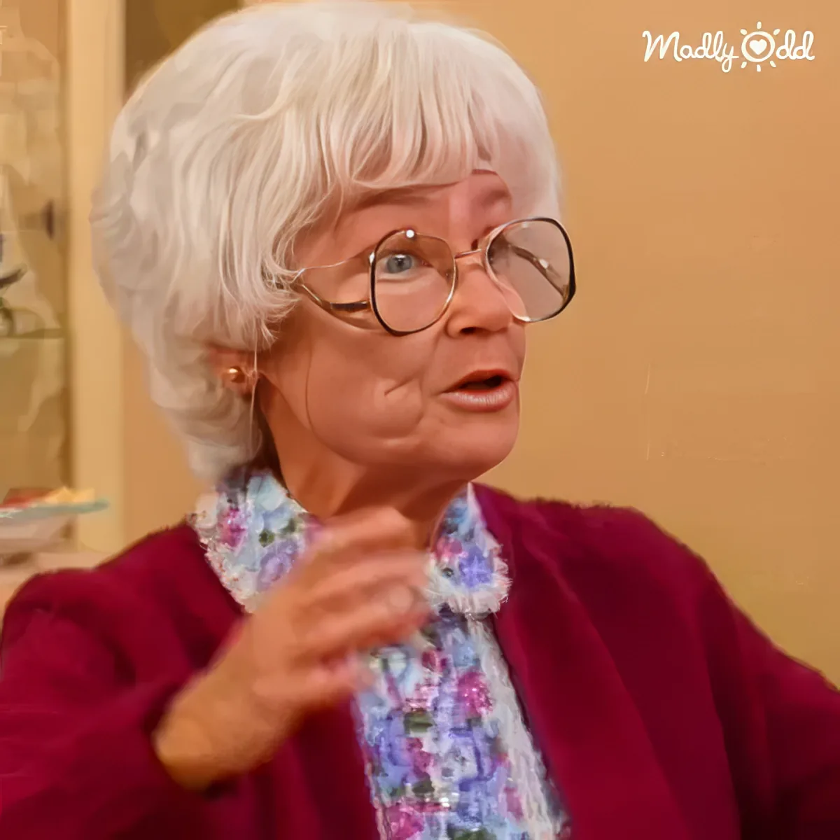 Sophia tells wild 'Sicily' stories, gesturing animatedly, listeners intrigued.