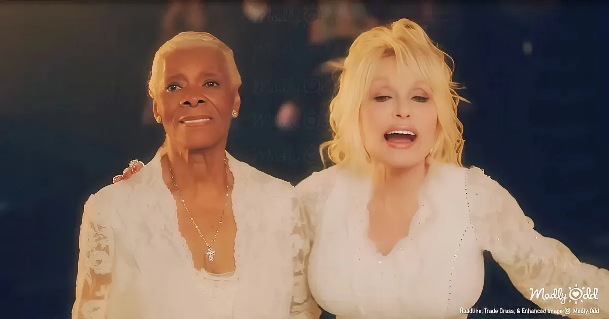 Two women in white outfits, one with blonde hair, both smiling and posing together.