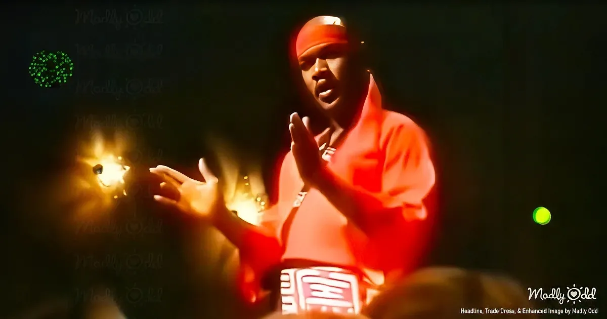 A person in red attire claps hands with glowing lights and text overlay in the background.