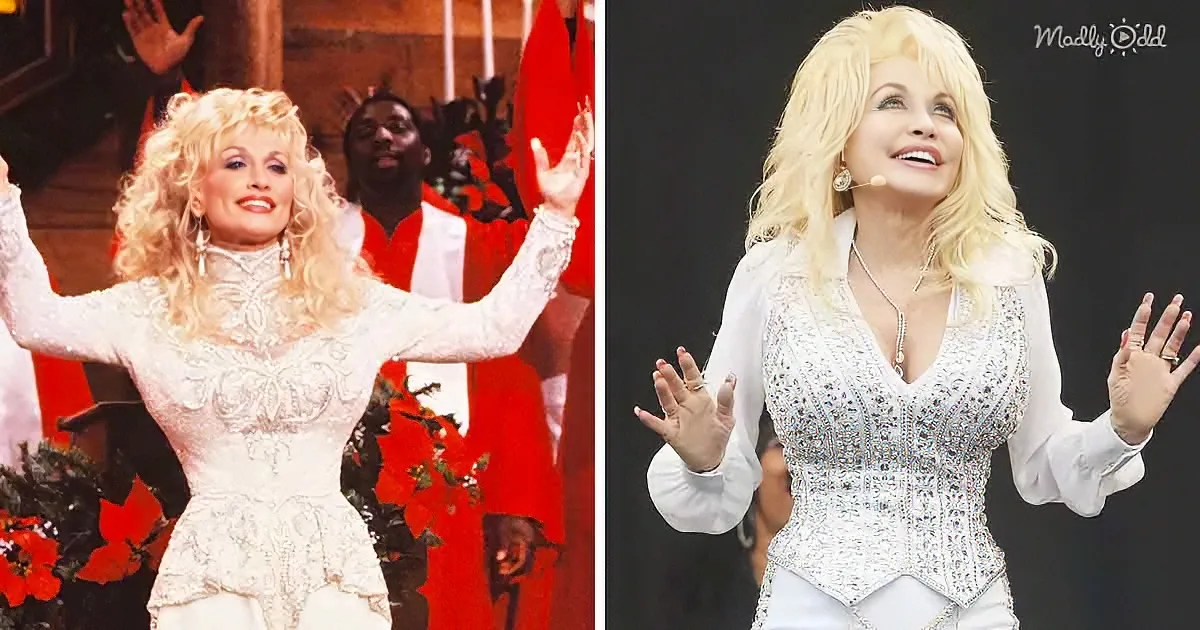 Dolly Parton, wearing a white sequined outfit, is performing with her hands raised in a joyful pose.