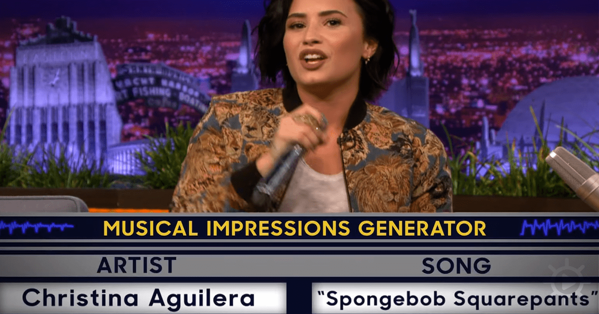 A woman in a leopard print jacket holds a microphone, singing on a TV show with a cityscape background.