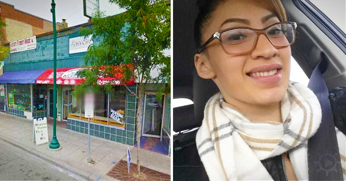 A woman smiles in a car, wearing glasses and a scarf, next to a storefront with a red awning and green tiles.