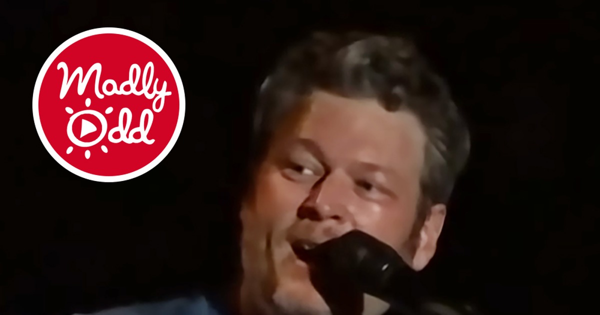 Blake Shelton sings into a microphone, holding a guitar, with text about a famous friend surprising the crowd.