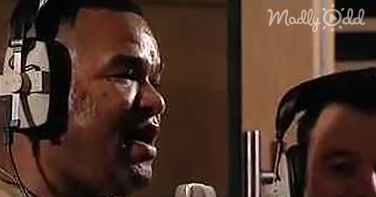 Two men in a recording studio, one singing into a microphone, text overlay mentions five soldiers singing a song.