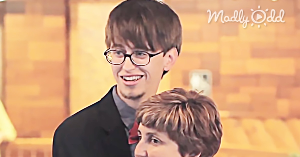 A mother and son share a joyful moment, performing an epic wedding dance together.