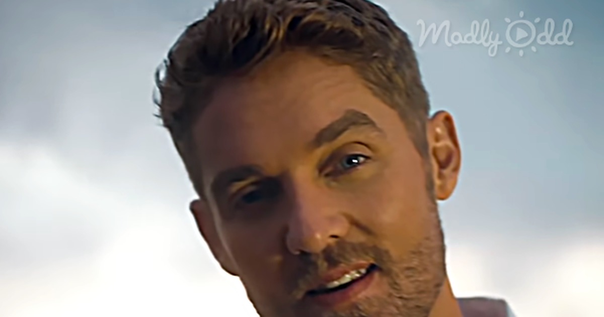 A man in a white shirt smiles against a cloudy sky, with text overlay praising Brett Young's song "Here Tonight."